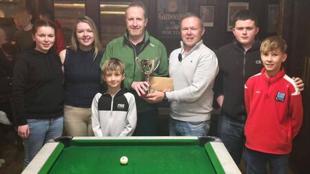 Local Notes: Langan family, Belmullet present the Derek Langan Memorial Pool competition trophy 