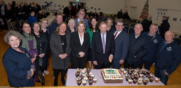 South West Mayo Development Company staff join Eamonn O’Cuiv for the cutting of the birthday cake. 	Picture: John Corless