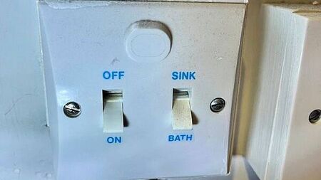 Warring couple in court over use of immersion switch