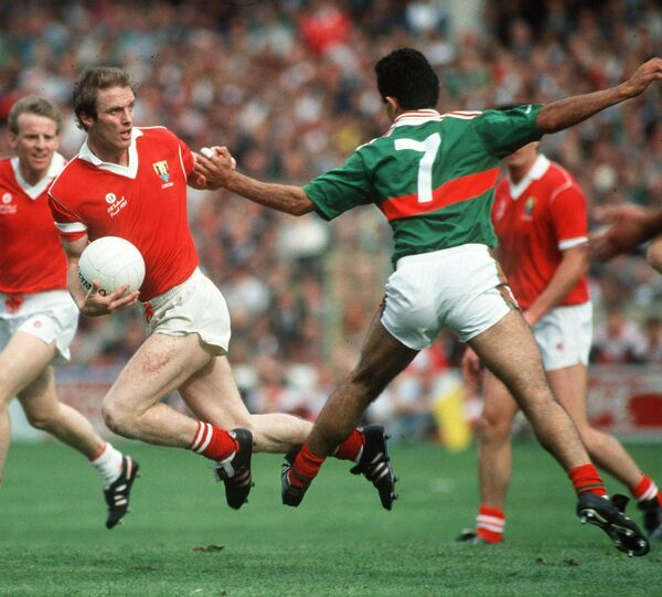 Cork's Larry Tompkins goes past John Finn of Mayo in the 1989 All-Ireland SFC final at Croke Park.