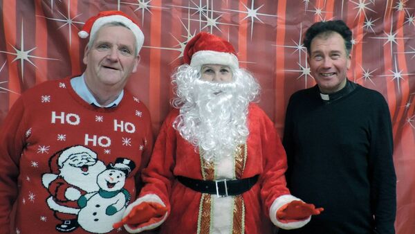 Santa Claus outlines the plan of action to local correspondent James Hunt and local parish priest Fr Joseph Gavigan on his arrival at Kilmovee Active Age Christmas party recently. Santa Claus outlines the plan of action to local correspondent James Hunt and local parish priest Fr Joseph Gavigan on his arrival at Kilmovee Active Age Christmas party recently.