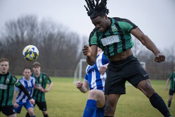 Ballyheane’s Ben Edeh powers up to head the ball. Picture: John Corless