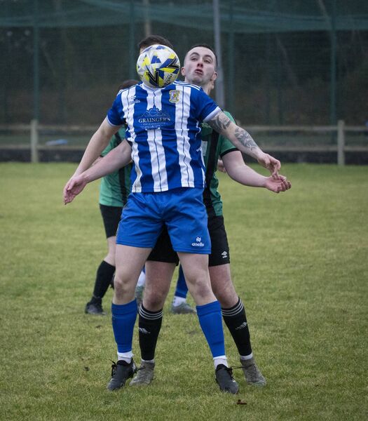 Ratoath’s Ben Bosze faces the ball, with Darragh Ludden of Ballyheane marking tight. Picture: John Corless