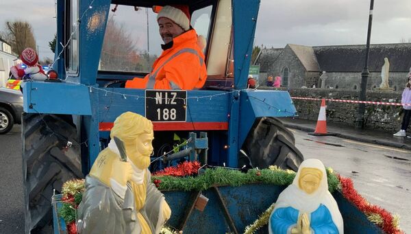 David Staunton checks on the safety of his passengers before the start of the recent Ballintubber tractor run. Picture by Tom Quinn.