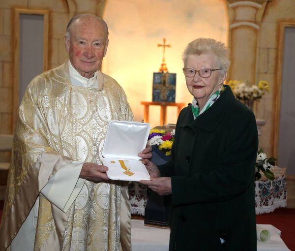 Canon Joe Feeney, AP Kiltullagh, presents the Bene Merenti medal to Josie Costello in recognition of her outstanding service as sacristan of St Patrick's Church, Cloonfad. Canon Joe Feeney, AP Kiltullagh, presents the Bene Merenti medal to Josie Costello in recognition of her outstanding service as sacristan of St Patrick's Church, Cloonfad.