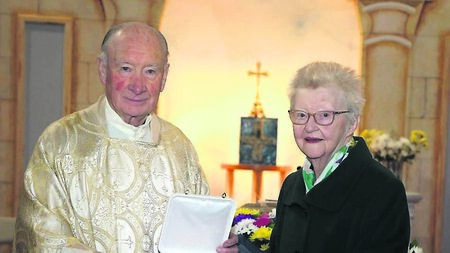 Presentation made to woman for outstanding service to local church