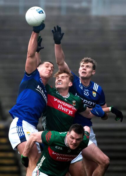 Jack Carney of Mayo is challenged by Kerry’s Cathal Ó Beaglaoich and Joe O'Connor.	Picture: INPHO/Evan Logan