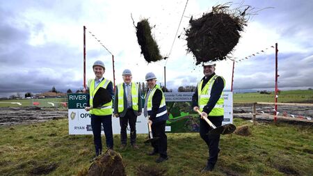 Minister turns sod on flood relief scheme