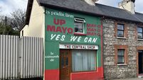 'Yes We Can' green and red house representing Mayo 300km away