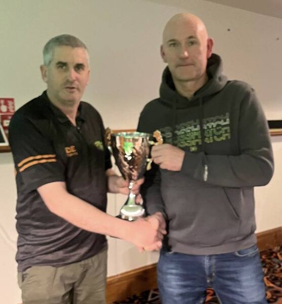 Dave Sweeney (right) receives his cup after winning the Mayo O50s pool championship in Achill. Dave Sweeney (right) receives his cup after winning the Mayo O50s pool championship in Achill.