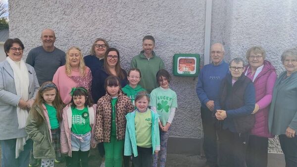Members of Clogher community pictured with the new defibrillator at Clogher Community Hall. 