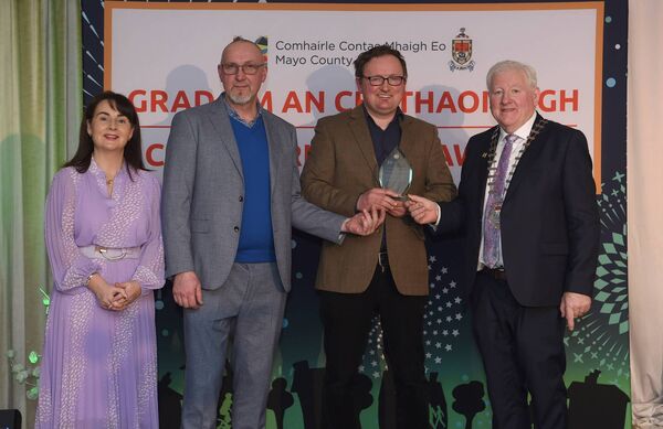 Pictured at the Cathaoirleach’s Awards 2024 being presented with their award by Cathaoirleach Cllr John O’Hara were the winners of the Environmental Awards - Environmental Initiatives: Energy and/or Travel ) Ballyhaunis Bike Repair Clinic (Travel Winner). 