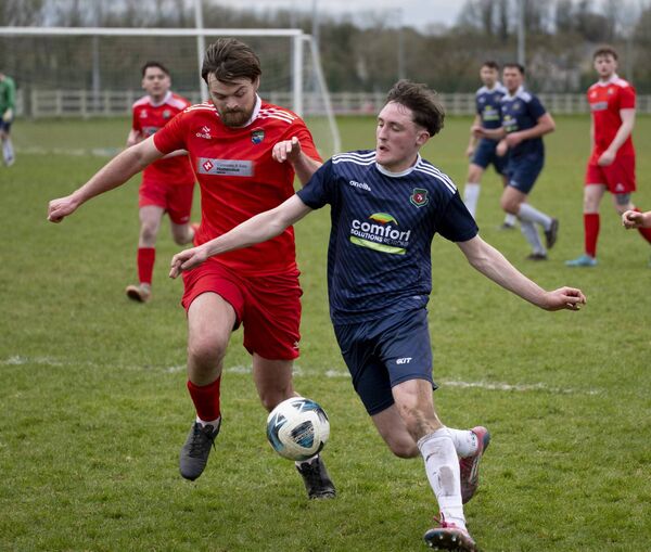 Ballinrobe Town’s Peter Finnerty battles Glenhest Rovers’ Eoghan Wright for possession. Picture: John Corless