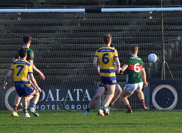 Mayo captain John MacMonagle watches his fisted effort crash to the back of the Roscommon net. Picture: David Farrell Photography