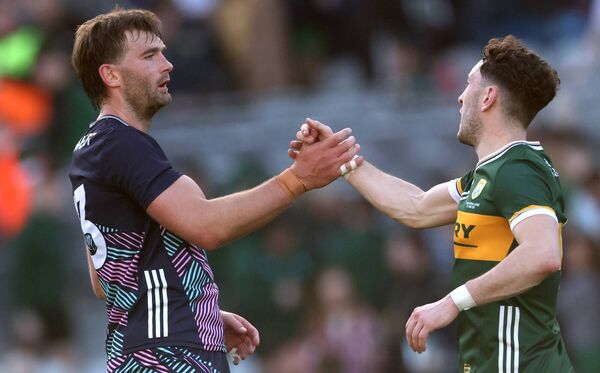 Aidan O'Shea congratulates Paudie Clifford following Kerry's win against Mayo.
