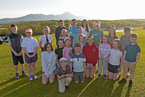 Junior boys and girls members of Westport GC having their photo taken with the legendary golf trophy, the Claret Jug. Junior boys and girls members of Westport GC having their photo taken with the legendary golf trophy, the Claret Jug.
