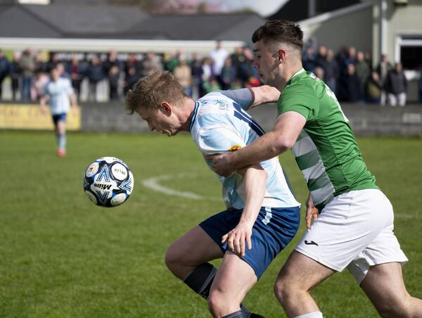 Salthill Devon's Timmy Molloy competing with Castlebar Celtic's Eoghan Hughes. 