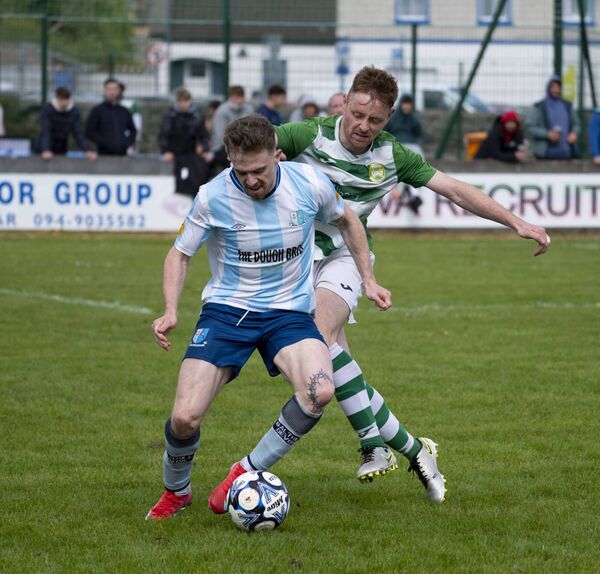 Salthill Devon's Matthew Barrett shields the ball from Castlebar Celtic's Niall Brennan. Picture: John Corless
