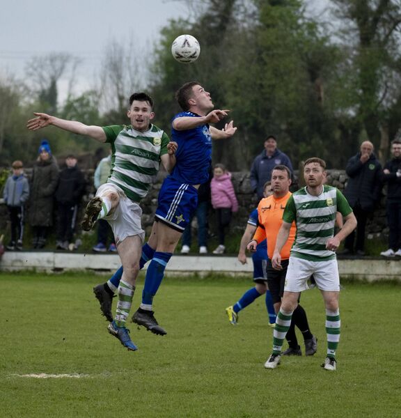 Castlebar Celtic's Oran Groarke challenges St John’s captain Leonard Simon. Picture: John Corless