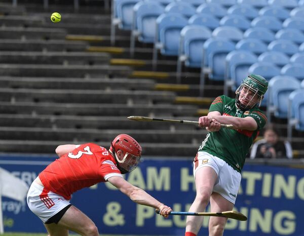 Mayo’s Eoin Delaney shoots for the posts despite the close attention of Louth’s Conor Quigley during the Nicky Rackard Cup championship at Hastings Insurance MacHale Park, Castlebar, last Saturday. Picture: David Farrell Photography 