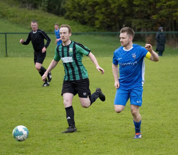 Ballyheane's Seán Kilcoyne and Ballina Town's Dylan McKee in a race for the ball. Picture: John Corless