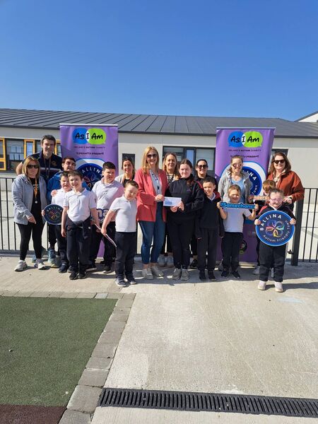 Alisha Beattie from Ballina As I Am group receives a cheque from Kayleigh, at Culleens National School, Ballina. The cheque represents the proceeds of the recent Rainbow Non-uniform day at the school to mark World Autism Day. The pair are pictured alongside staff and students from Little Stars classes at Culleens National School. Back row, from left, are Carrie Holmes, James Daughton, Elaine Tighe, Sophie Goldrick, Claire Gallagher, Shakira Kelly, Jenny Mullarkey and Mary Melvin. Other children from Little Stars include Rian, Cillian, Orhan, Luke, Alex, Leszek, Oisìn and Grace. 