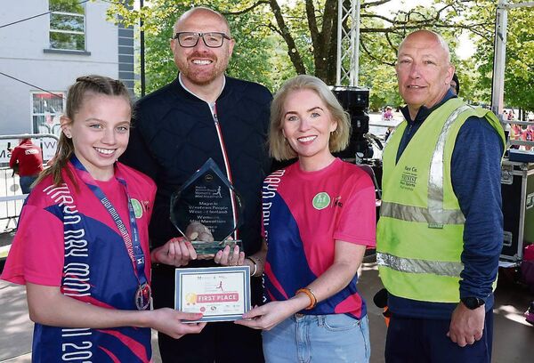 Freya Renton is presented with 1st Prize by Joanne Grehan, Director of Services Mayo Co Co, pictured with Aidan McNulty, Advertising Manager Western People, and Charlie Lambert, Mayo Sports Partnership, after her victory. At just 15 years old, teenage running sensation Freya Renton claimed first place in this year's Mayo.ie Western People Women's Mini Marathon 2025