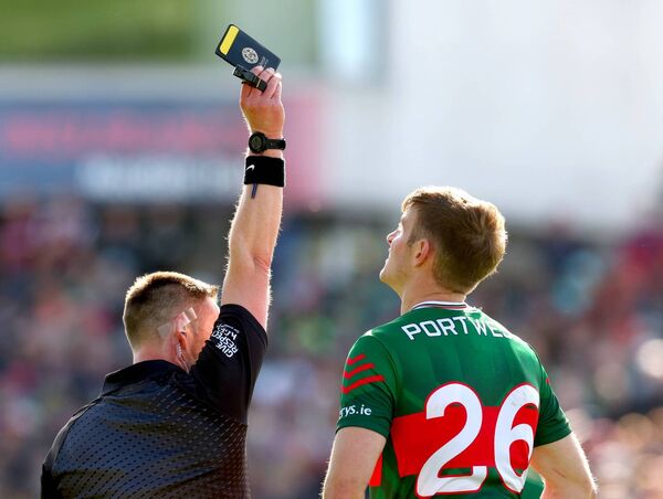 Referee Paddy Neilan issues a black card to Mayo's Rory Brickenden during the Connacht SFC final earllier this month.	Picture: INPHO/James Crombie