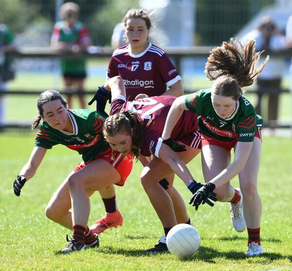 Grace McDonnell and Kate Brennan of Mayo battle for possession with Galway’s Aoibhinn Reddington. 
