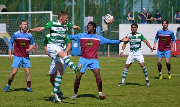 Castlebar Celtic’s Niall Brennan is challenged by Mervue United’s Lewis Waweru. 