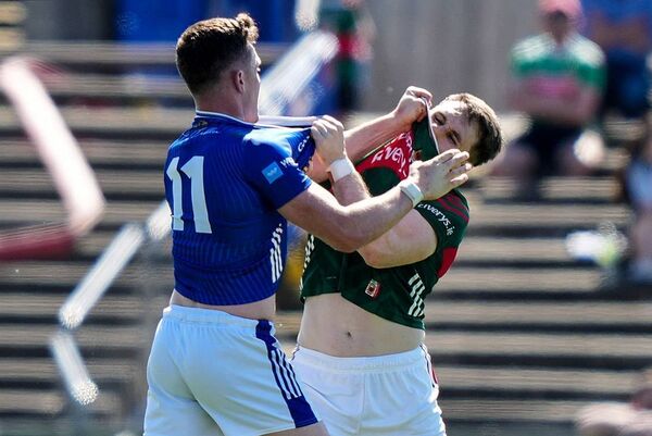 Paddy Durcan gets to grips with Cavan's Dara McVeety at the point of the Mayo captain's second-half introduction.	Picture: INPHO/James Lawlor
