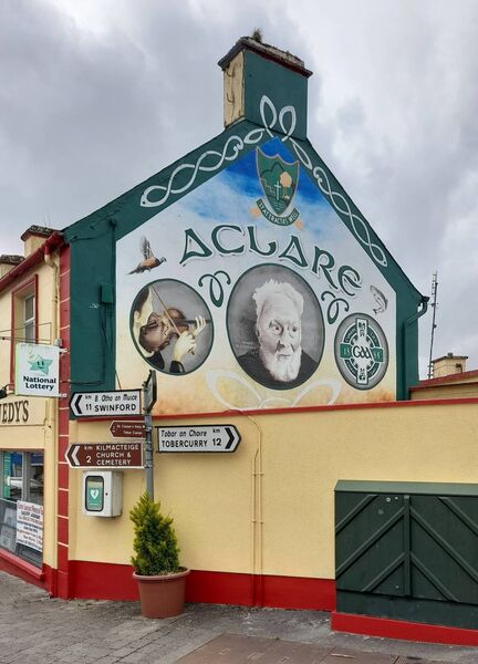 A fantastic wall mural, painted on the wall of Kennedy’s shop in Aclare, includes an image of Fr Stephen. A fantastic wall mural, painted on the wall of Kennedy’s shop in Aclare, includes an image of Fr Stephen.