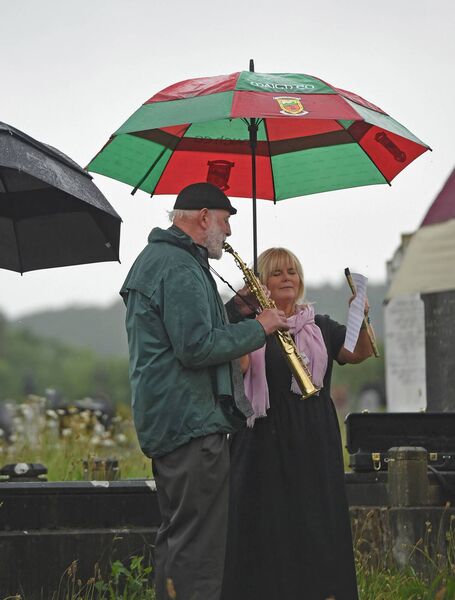 Local musicians Dan Delaney and Kathy Quinn perform during the burial service for poet Paul Durcan at Aughavale Cemetery Westport. Picture: Conor McKeown