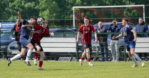 Glenhest Rovers captain Chris Rowland challenges Westport United's Dylan O’Malley with Alex Halpin and Levi Barrett, right, watching. Picture: John Corless Glenhest Rovers captain Chris Rowland challenges Westport United's Dylan O’Malley with Alex Halpin and Levi Barrett, right, watching. Picture: John Corless