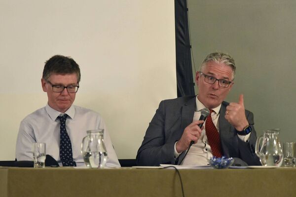 GAA Director General Tom Ryan listens as GAA President Jarlath Burns addresses Mayo GAA delegates in Westport on Monday night.	Picture: Conor McKeown