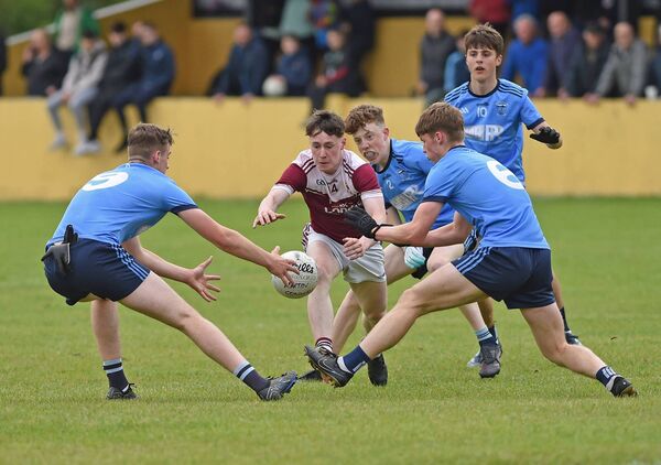 Oisin Deane of Crossmolina in a bid to reach the football before Westport's Michael McDonnell and Peter McGowan.
