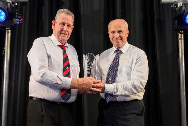 No Name Club board member Sean Twomey (right) makes a presentation to Con Nolan for over 25 years of service with No Name Club. No Name Club board member Sean Twomey (right) makes a presentation to Con Nolan for over 25 years of service with No Name Club.