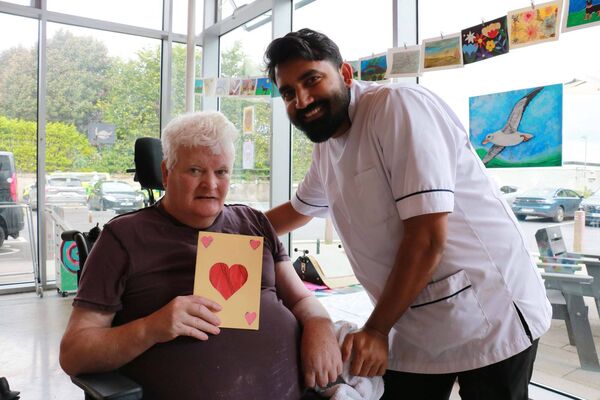 Resident Val Conlon and Shibo Cleatus, Healthcare Assistant, Sacred Heart Hospital Castlebar.