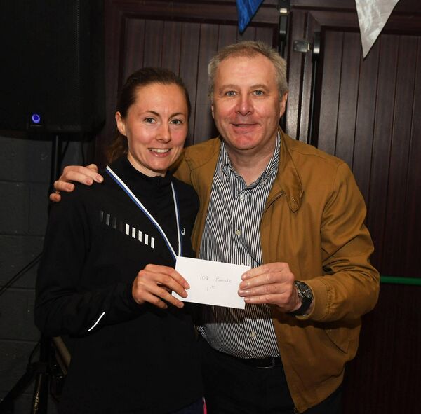 10k women's race winner Aisling Moyles receives her prize from Midwest Radio's Gerry Glennon who was the special guest. Picture: John O'Grady