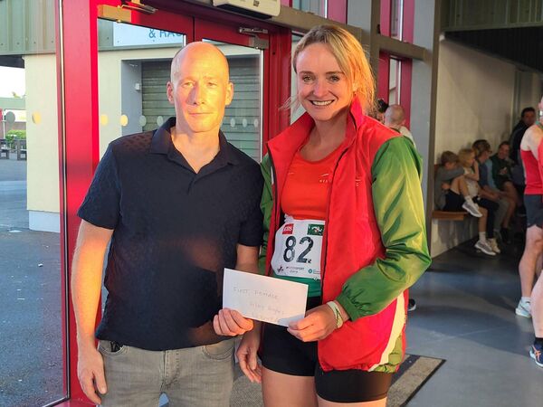 Westport AC’s Hillary Hughes receives her prize from Mick Shaw of series sponsors Shaw Commercials as the first woman overall in the Mayo AC 5k Series. Westport AC’s Hillary Hughes receives her prize from Mick Shaw of series sponsors Shaw Commercials as the first woman overall in the Mayo AC 5k Series.