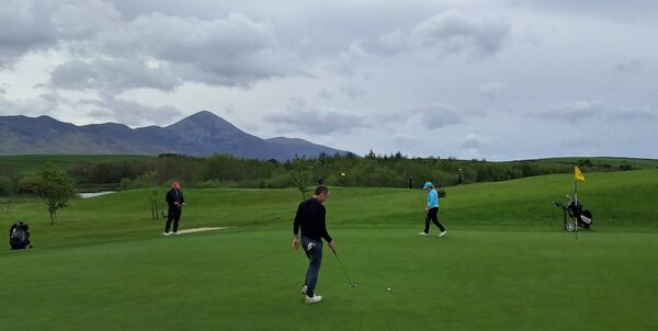 On the green at Westport Golf Club with majestic Croagh Patrick in the background were, from left: Malachy Stephens (former European 400m champion), James Conaghan and Una Stephens. On the green at Westport Golf Club with majestic Croagh Patrick in the background were, from left: Malachy Stephens (former European 400m champion), James Conaghan and Una Stephens.