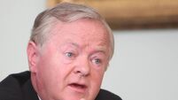 Higgins defends links to Iranian opposition group