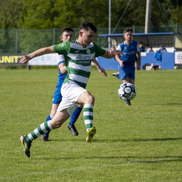 Castebar Celtic's Luke Kelly on the ball with Manulla's Gavin Jennings in pursuit. Castebar Celtic's Luke Kelly on the ball with Manulla's Gavin Jennings in pursuit.