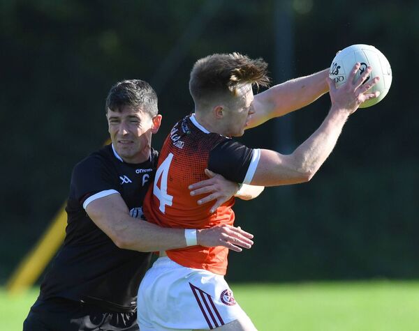 Balla’s Brian O’Donovan is closely marked by Crossmolina’s Conor Loftus.