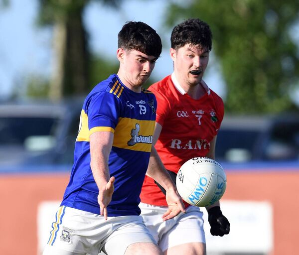 David Quinn of Mayo Gaels takes on Garrymore’s Kenneth Lydon. 