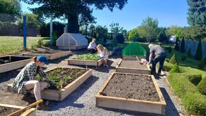 Local Notes: Volunteers at work in Charlestown Organic Community Garden.