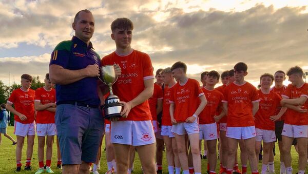 Shane Quinn, Cathaoirleach of the West Mayo GAA Board presented the winning Cup to the Ballintubber U16 captain, Tiernan O’Toole. Picture by Tom Quinn. Shane Quinn, Cathaoirleach of the West Mayo GAA Board presented the winning Cup to the Ballintubber U16 captain, Tiernan O’Toole. Picture by Tom Quinn.