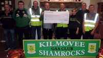 Local Notes: Kilmovee Shamrocks GAA present proceeds of tractor run to Kilmovee Civil Defence