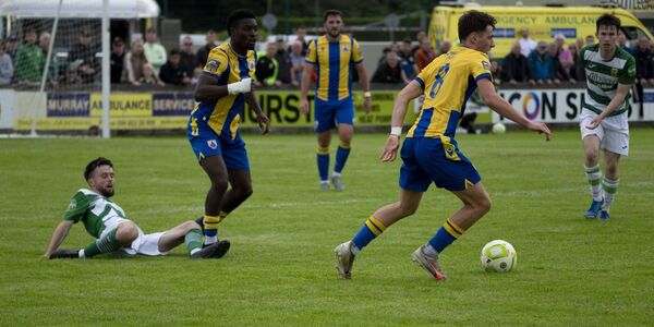 Longford’s Emre Topcu (number 8) moves the ball upfield, surviving Dylan Edwards’s tackle. Also in the picture are Longford’s Osaze Irhue and Óisin Hand with Celtic’s Oran Groarke. 
