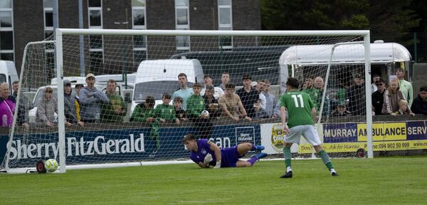 So close! Longford goalkeeper Kian Moore dives the right as Dylan Edwards watches his shot skim past the post with the score tied at 3-3 at the time. 